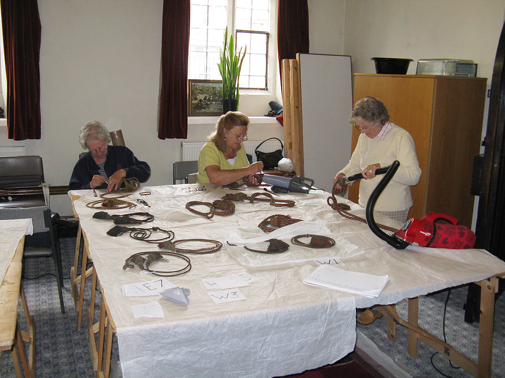 Volunteers assisted with surface cleaning under supervision.