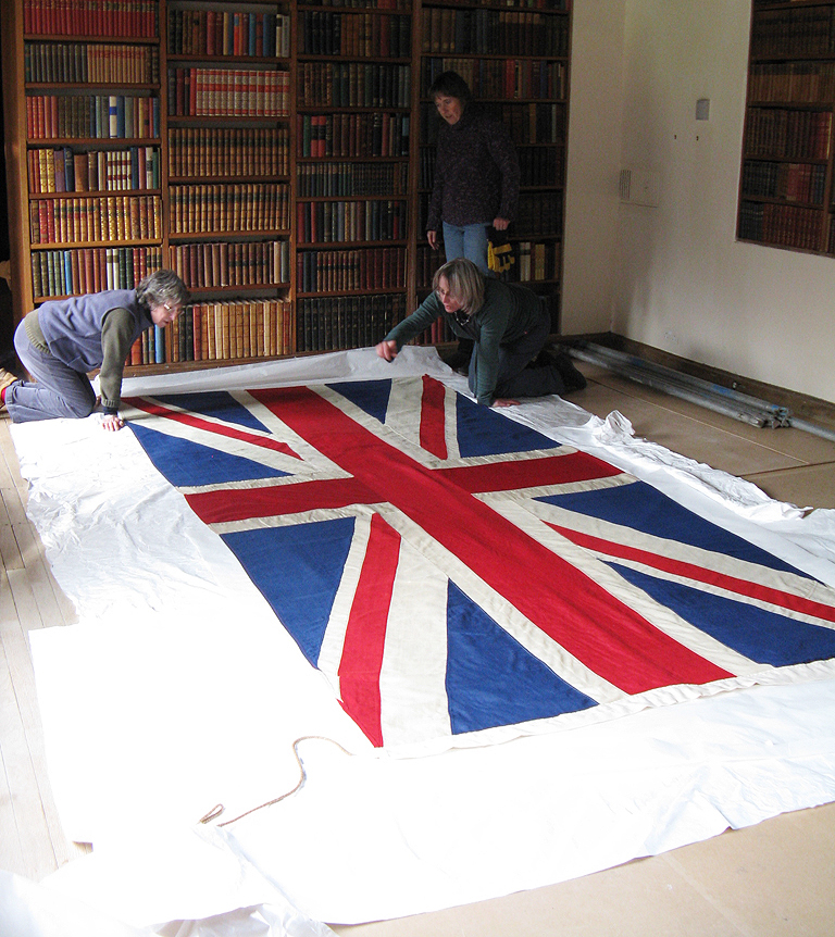 Preparing the flag for reinstatement, on site.