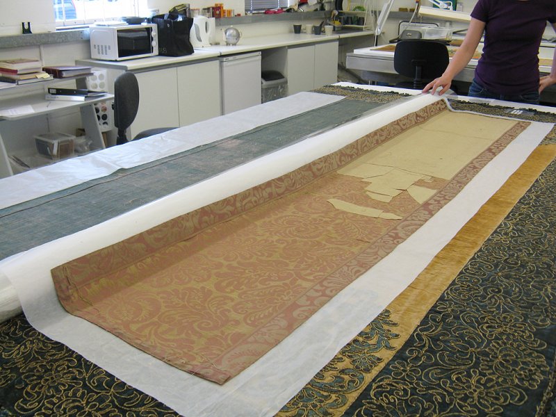 The unfaded reverse side of the replacement damask panels.