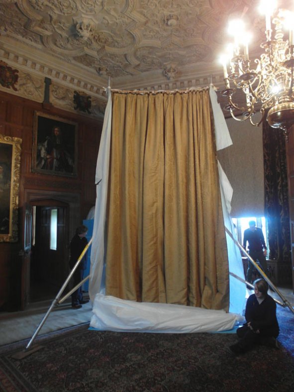 The curtain tied to scaffold during installation.