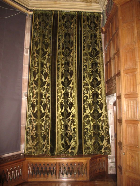 The curtain in place after conservation treatment.