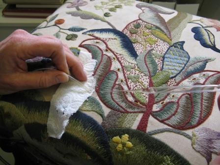 Removing the water stains on the stool cover.