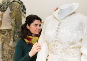 Conservator working with Mrs. Albertson's wedding dress (IWM Copyright)