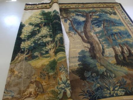 The colour change on the front of the tapestry (right) compared to the reverse (left) Note the dramatic change in the green foliage to blue. This is due to the faster fading of the yellow dye than the blue dye which are combined to produce the final green intended in the original.