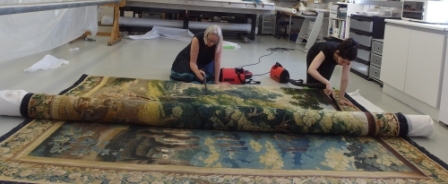 May and Maria vacuuming the reverse of the tapestry